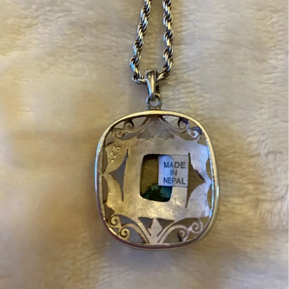 Authentic Handmade Turquoise sterling silver pendant from Nepal. Pendant only.